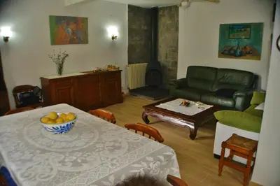 a living room with a table and a couch at Casa Las Violetas in Altura