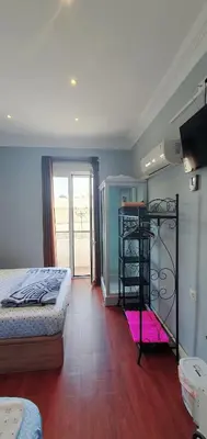 a bedroom with a bed and a television in a room at Habitación cerca del centro in Valencia