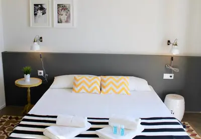a bedroom with a large white bed with towels on it at Apartamento Con Vistas Espectaculares in Valencia