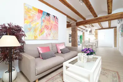 a living room with a couch and a table at Vivaldi Center City in Valencia