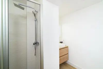 a shower with a glass door in a bathroom at Vivaldi Center City in Valencia