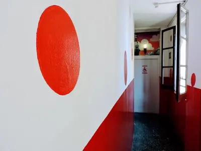 a red heart on a wall in a hallway at Feetup Home Backpackers Valencia in Valencia