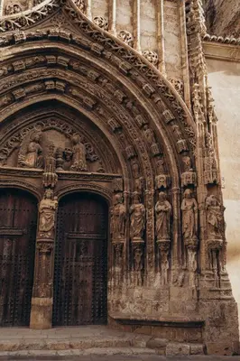 a building with statues on the front of it at Hotel Restaurante Doña Anita in Requena