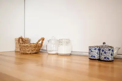 a group of jars sitting on a wooden floor at Casa Marcellino Valencia Centro in Valencia