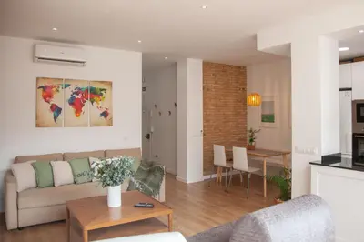 a living room with a couch and a table at Casa Marcellino Valencia Centro in Valencia