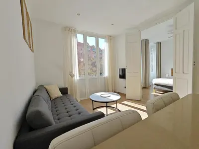 a living room with a couch and a table at Hola Valencia - Holiday Apartments in Valencia