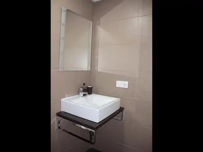 a bathroom with a white sink and a mirror at Apartment Sofi in Valencia
