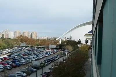 a large parking lot with a bunch of parked cars at Apartamento en la Ciudad de las ciencias in Valencia