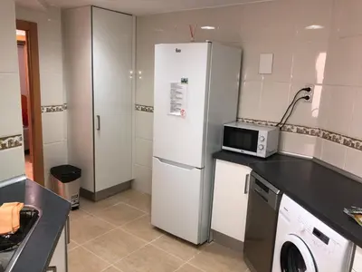 a living room with two couches and a tv at Calle Mora De Rubielos in Valencia