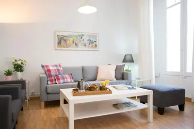 a living room with a couch and a coffee table at Antiguo Reino Apartment in Valencia