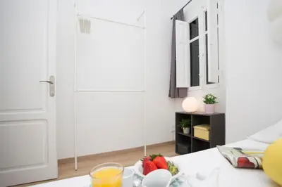 a kitchen with a bowl of fruit on a table at Antiguo Reino Apartment in Valencia