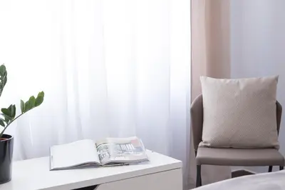 a bedroom with a desk with a book and a chair at MD Oliag in Valencia