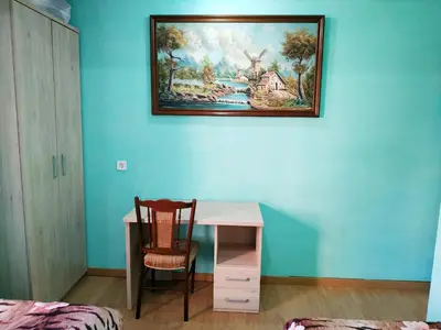a bedroom with a desk and a painting on the wall at Apartamento Turistico en Valencia in Valencia