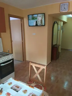 a living room with a tv on the wall and a table at Apartamento Turistico en Valencia in Valencia
