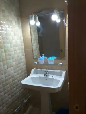 a bathroom with a white sink and a mirror at Apartamento Turistico en Valencia in Valencia