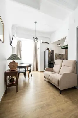 a living room with a couch and a table at Live in Chianti Apartaments by Concept Flats in Valencia