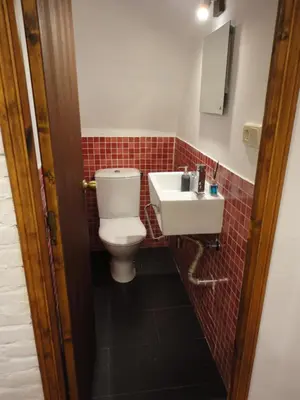 a bathroom with a toilet and a sink at Center Valencia in Valencia