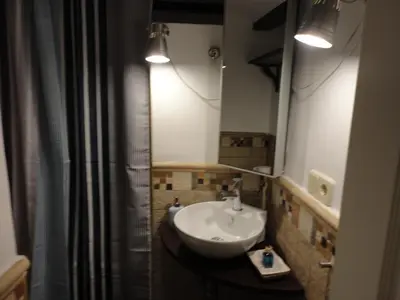 a bathroom with a sink and a mirror at Center Valencia in Valencia