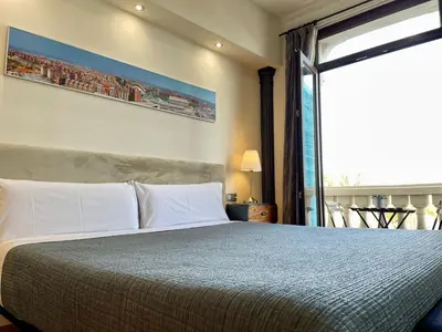 a bedroom with a large bed with a large window at Balcón Al Mar in Valencia