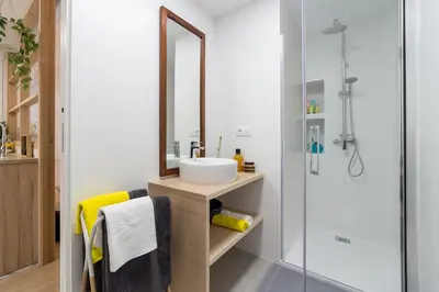 a bathroom with a sink and a mirror at Valencia Just in the Middle in Valencia
