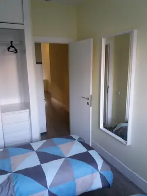 a bedroom with a bed and a mirror on the wall at El Católico 56 in Valencia