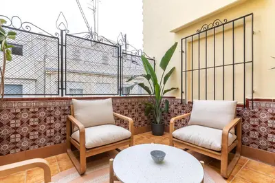 a balcony with two chairs and a table at Nommadas Jero - Only Adults in Valencia