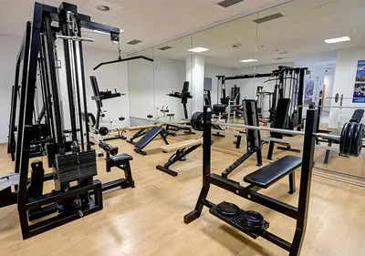a gym with a lot of treadmills and machines at Hotel Vila-real Azul in Villareal