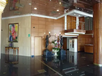 a lobby of a building with sculptures on the wall at Hotel Vila-real Palace in Villareal