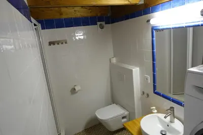 a bathroom with a toilet and a sink at Casa La Abuela in Chulilla