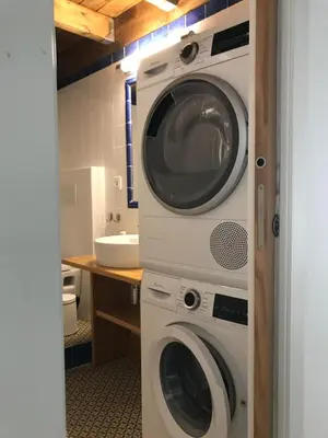 a washing machine and a dryer in a bathroom at Casa La Abuela in Chulilla