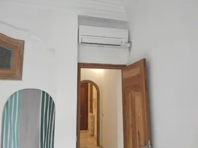 a hallway with a ceiling fan and a mirror at Entre la Estación y el Ayuntamiento in Valencia
