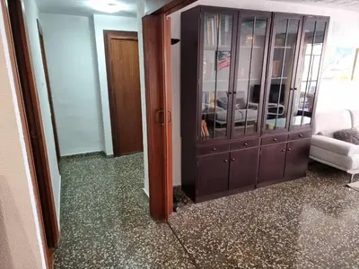 a living room with a cabinet and a living room at Apartamento Ruzafa in Valencia