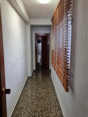 a hallway with a wine rack on the wall at Apartamento Ruzafa in Valencia