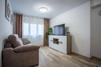a living room with a couch and a tv at Versus Apartments near City of Arts 2 in Valencia