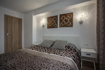 a bedroom with a bed with two pillows on it at Versus Apartments near City of Arts 2 in Valencia