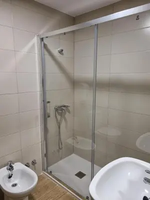 a bathroom with a shower and a sink at Hostal Andrés in El Saler
