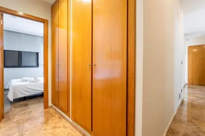 a room with wooden doors and a bedroom with a bed at Exclusive Museum in Valencia