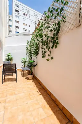 a balcony with plants on a white wall at Exclusive Museum in Valencia