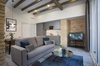 a living room with a couch and a table at SingularStays Parque Central in Valencia