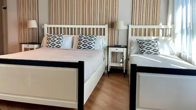 a bedroom with two beds with pillows on them at MD Modern Hotel - Jardines in Valencia