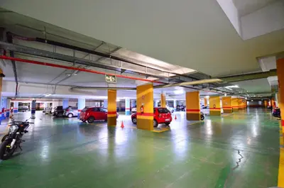 an empty parking garage with cars parked in it at Apartamento frente al mar in Valencia