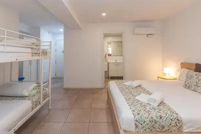 a bedroom with two beds and a bunk bed at BET Apartments - Abastos in Valencia
