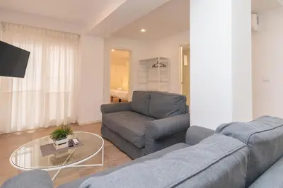 a living room with a couch and a table at BET Apartments - Abastos in Valencia