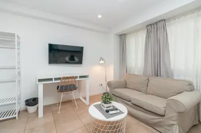 a living room with a couch and a table at BET Apartments - Abastos in Valencia