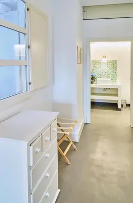 a white kitchen with a sink and a desk at Splendid houses in Valencia in Valencia