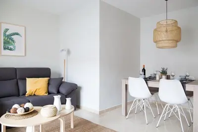 a bedroom with a bed and a door with a window at New Aloha Apartment Center with terrace Valencia in Valencia
