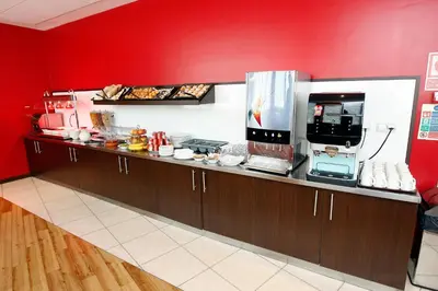 a kitchen with a counter with food on it at Travelodge Valencia Aeropuerto in Manises