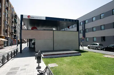 a large building with a bed in the grass at Travelodge Valencia Aeropuerto in Manises