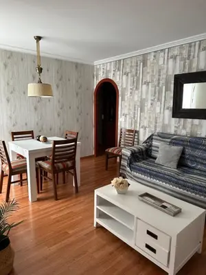 a living room with a couch and a table at Cristina Apartamento Center in Valencia