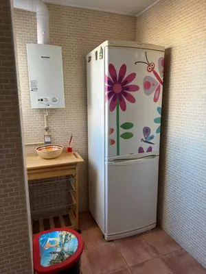 a refrigerator in a kitchen with a flower painted on it at Cristina Apartamento Center in Valencia